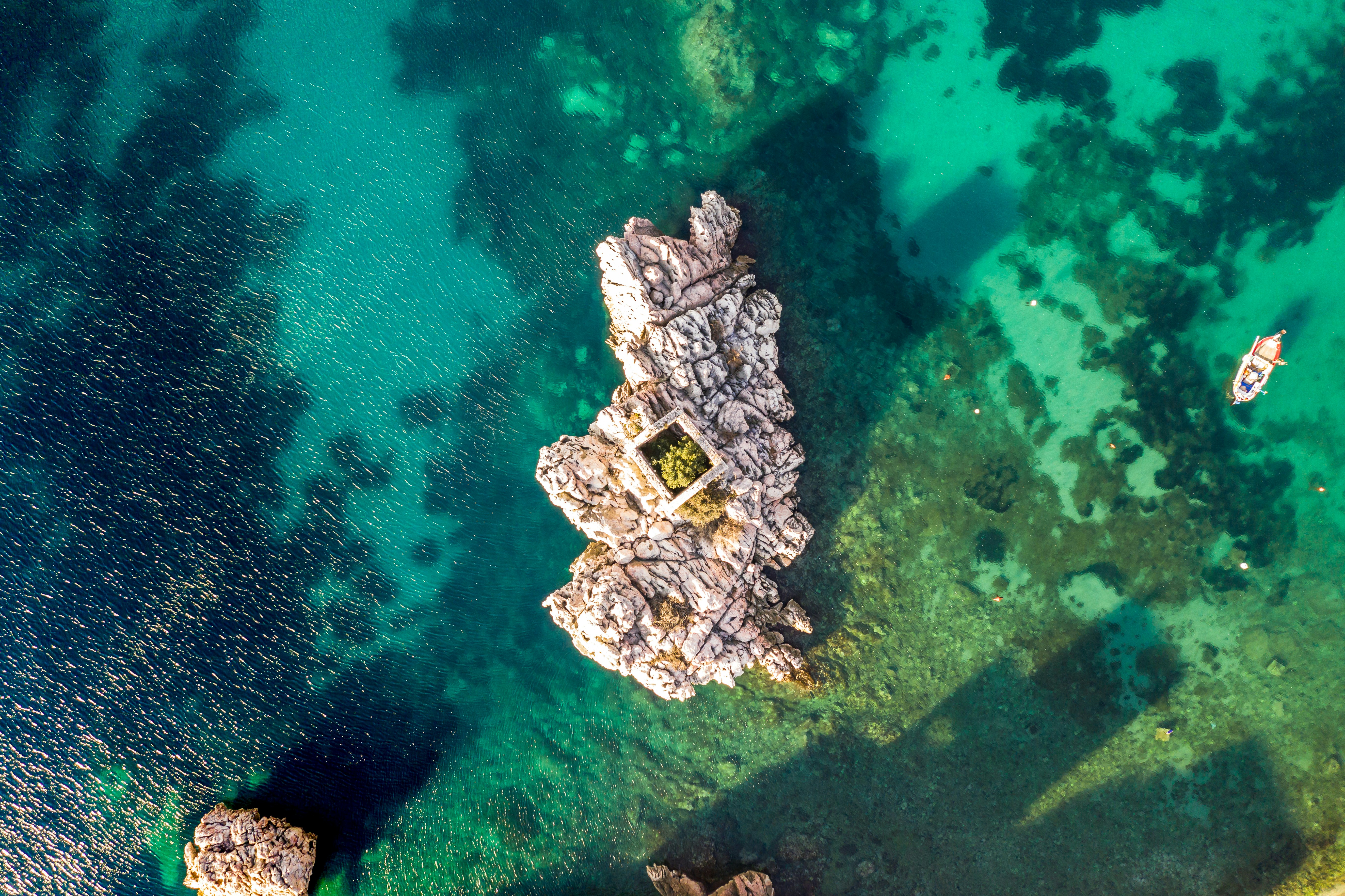 aerial photo of boat on body of water during daytime